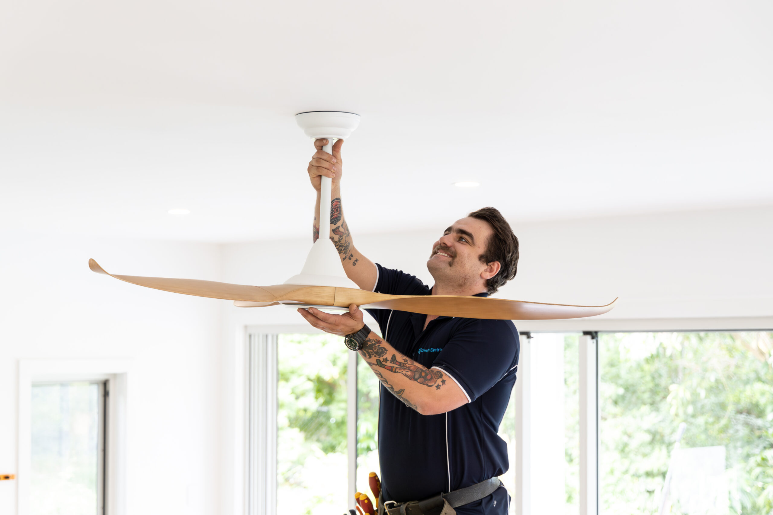 Dawson-179 electrician installing a fan